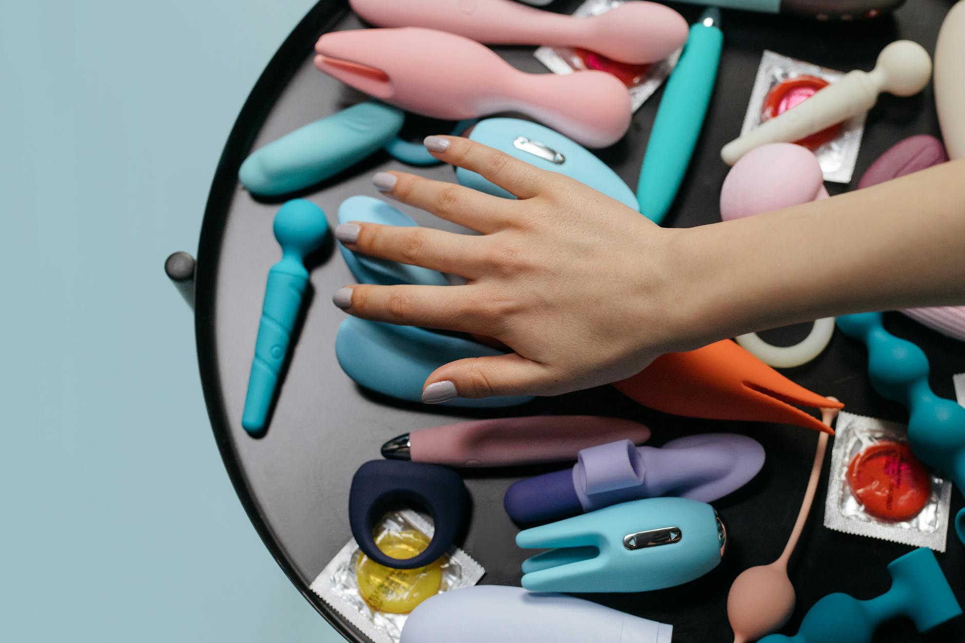 A couple holding a vibrator together, demonstrating modern intimacy and communication.