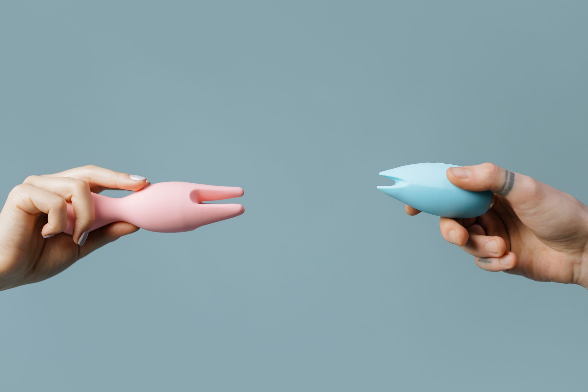 Close-up of a woman's hand holding a fresh lemon, representing sensitivity and bodily awareness