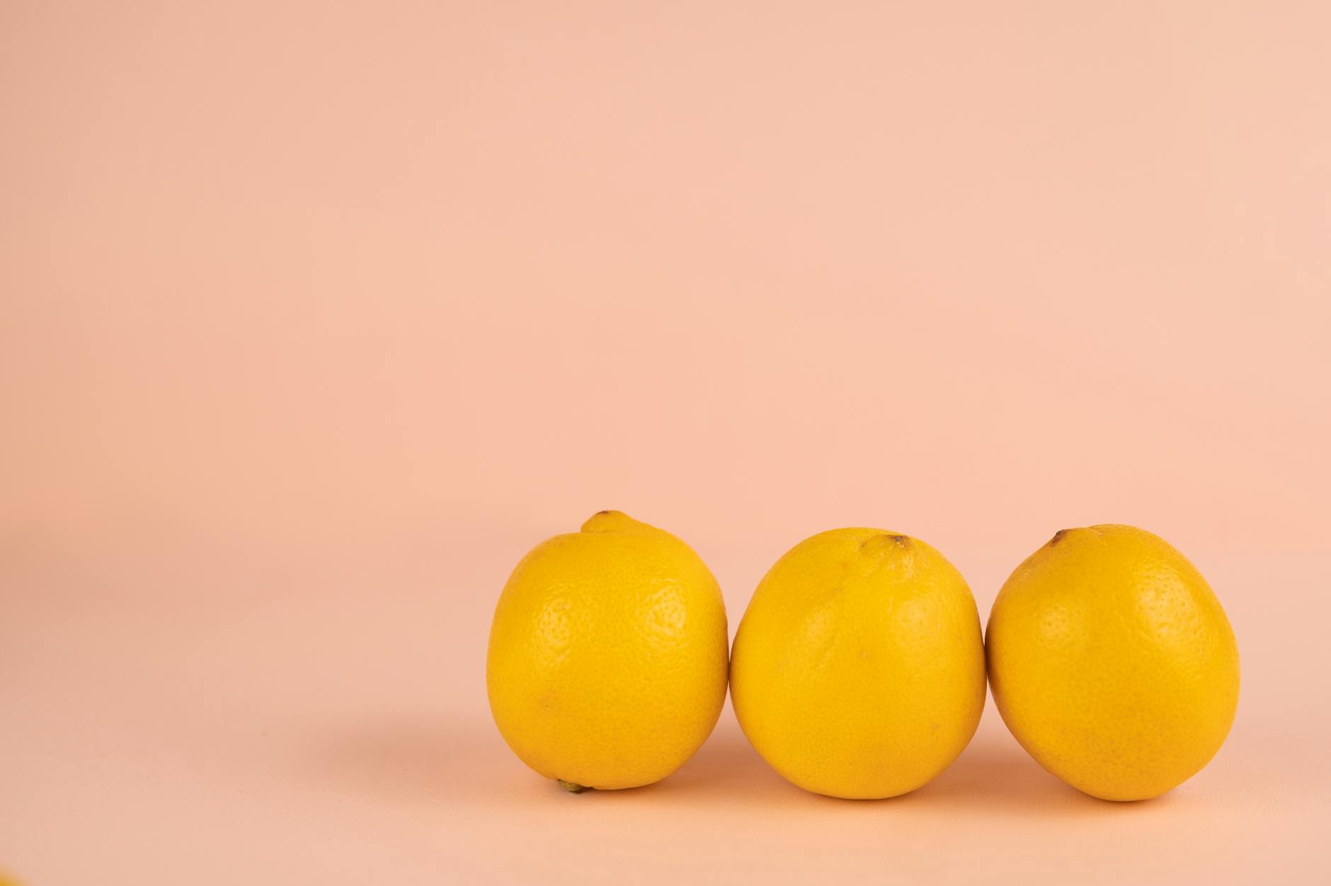 Bright yellow lemons on a pastel background representing renewal and healing